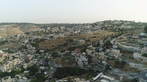 Aerial view of hills with houses alt