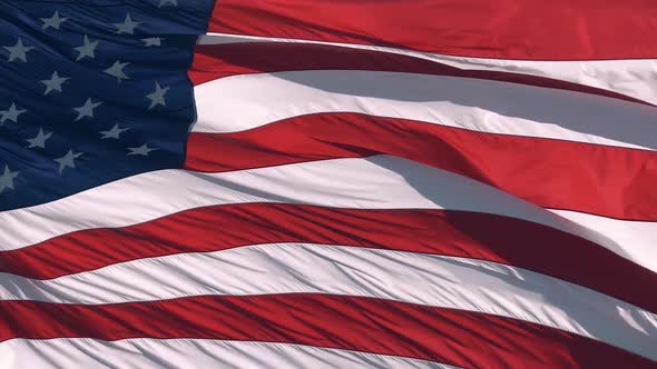 American Flag Flying in the Wind at Sunny Day,  alt