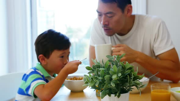 Father and son having breakfast alt
