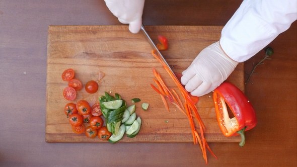 Chef Cutting Red Bell Pepper