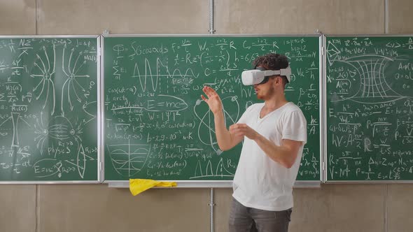 Portrait of Bearded Teacher Wearing Virtual Reality Headset in School Classroom alt