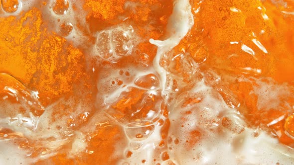 Super Slow Motion Shot of Rippling Fresh Beer Wave From Top Shot at 1000Fps alt