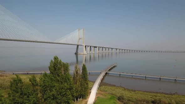 Flying over the longest bridge in Europe - Vasco da Gama in Lisbon, Portugal alt