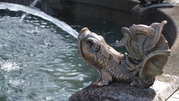 The cave is illuminated by a lantern light. Speleology, dark underground excavation tunnel. alt