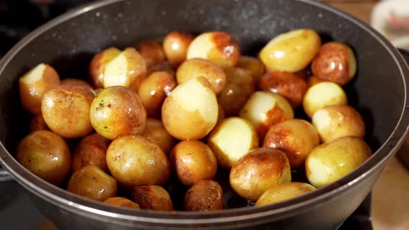 Small Potatoes Cooking On The Frying Pan With Oil