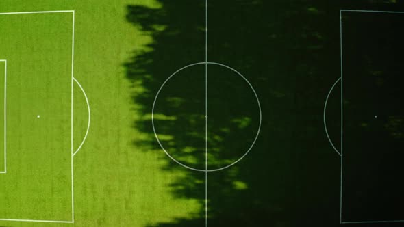 Flying Drone Zoom Out Shot of Epic Football Field