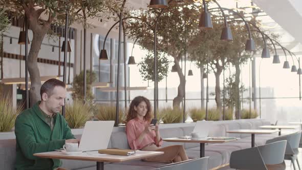 Freelancers Working in Coworking Cafe alt