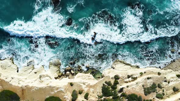 Rocky Coastline Cliffside with Blue Mediterranean Sea Ocean Water at Sunny Day Cyprus alt