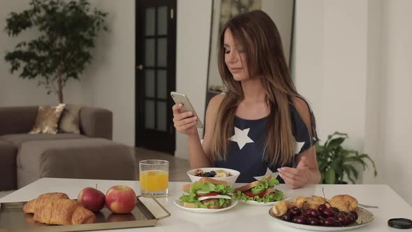 Beautiful Woman Is Having Breakfast at Home