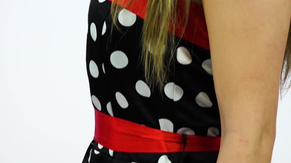 A Beautiful 50s Pin-up Girl Turns To the Camera and Smiles, Closeup, White Screen Background alt