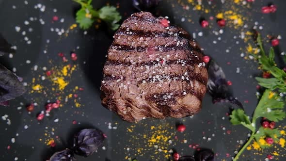 cook sprinkles cooked meat with fragrant red pepper. Top view alt