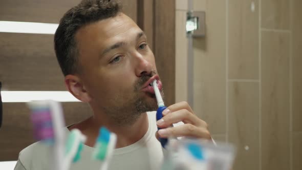 Handsome Guy Brushes Teeth