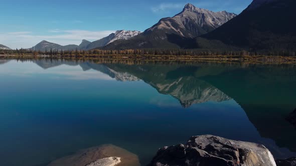 Lake shore mountains sunny day alt