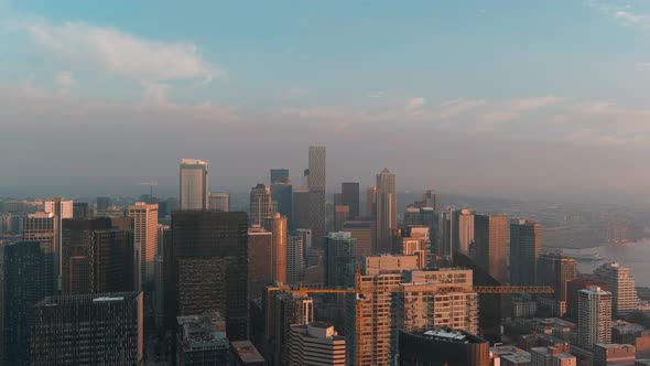 Aerial of Seattle's skyscrapers during golden hour sunset alt