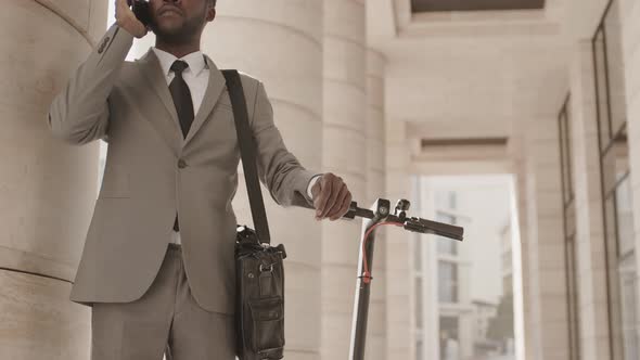 African Businessman Having Telephone Talk alt