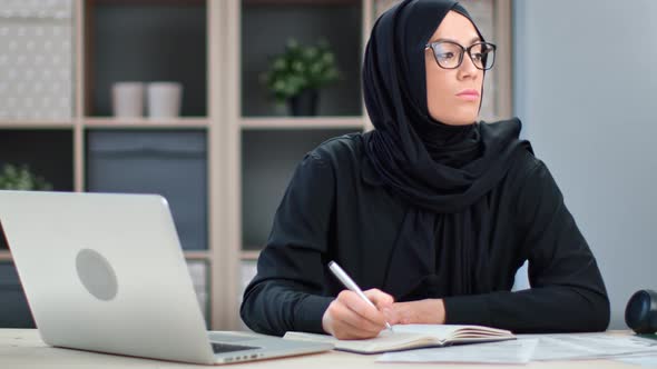 Confident Modern Young Muslim Woman Studying Distance e Learning Education at Home Workplace alt
