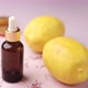 Essential Oil Bottle and Lemon on Yellow Background - VideoHive Item for Sale