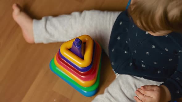 Child Plays with Designer Kit on the Floor, Top View alt