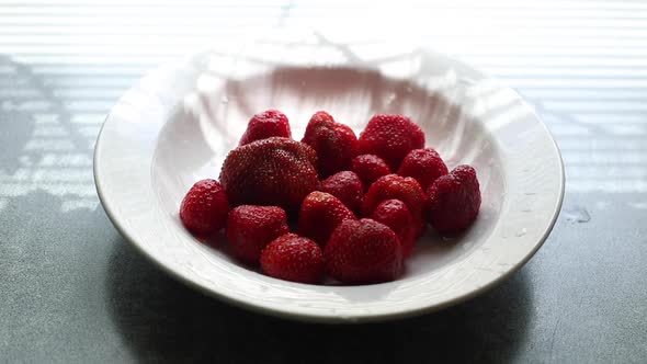 Fresh Strawberries in a Plate on the Table