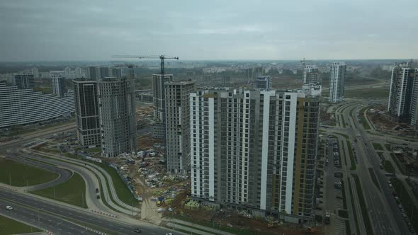 Construction of modern multi-storey buildings. Construction of a new city block. alt