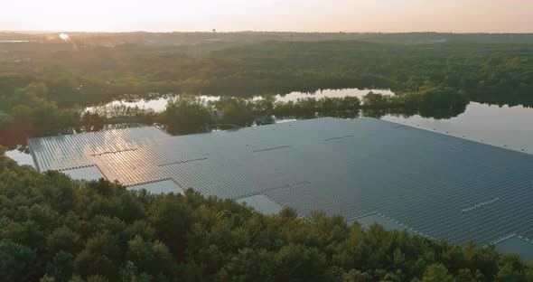 Aerial View of Environmentally Friendly Energy with Floating Solar Panels Platform System on the alt