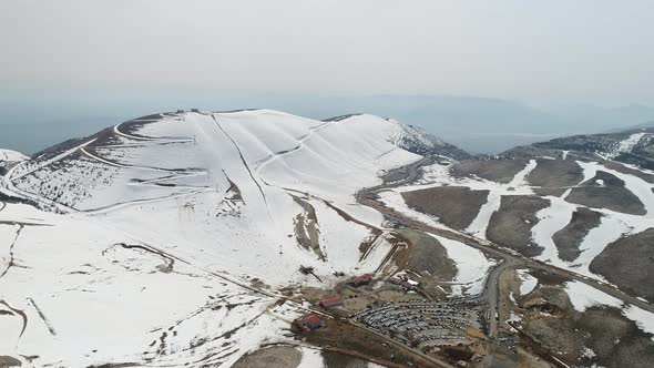 Snowy Mountains And Ski Center Aerial View alt