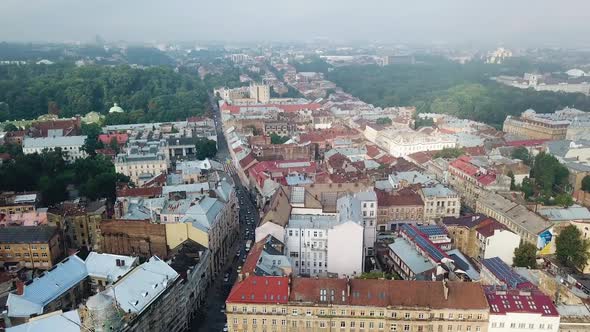 Top view of ancient city with the roofs of old architectural buildings. alt