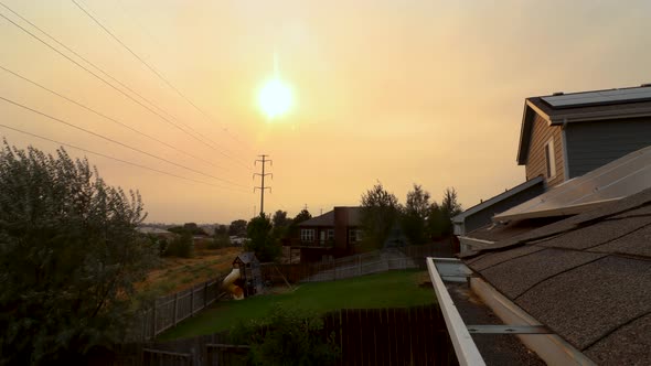 The sun sets in a sky filled with smoke and ashes during the 2020 forest fires in Colorado during Ju alt