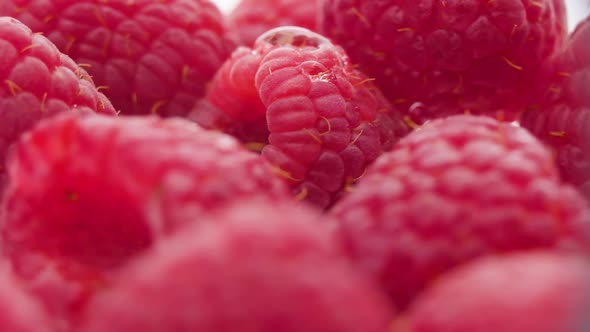 Fresh Juicy raspberries in extreme macro, water drop on red berry, Blurred foreground alt