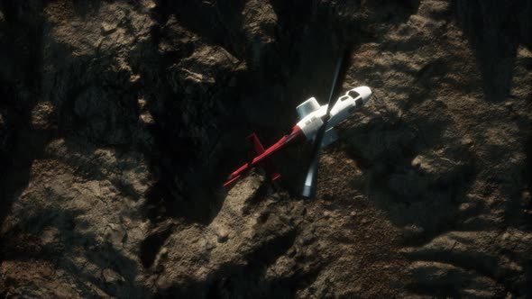 Slow Motion Helicopter Above Rocky Desert alt