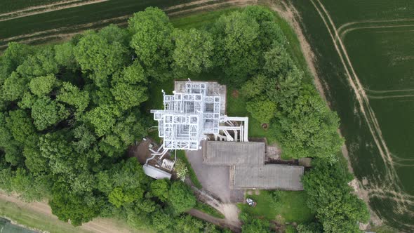 Telecoms mast , UK tower overhead birds eye view drone aerial view alt