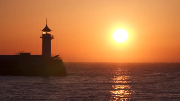 Lighthouse Illuminated By the Rising Sun