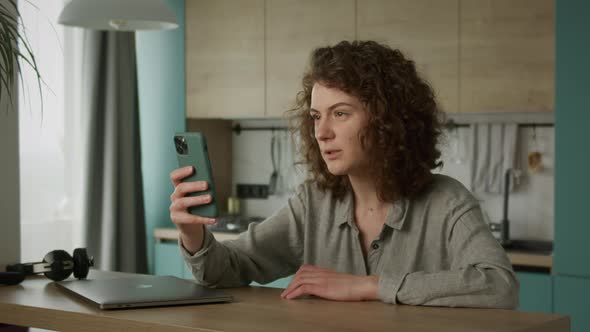 Young 20s Adult Student Having a Video Conference Call on Her Smartphone