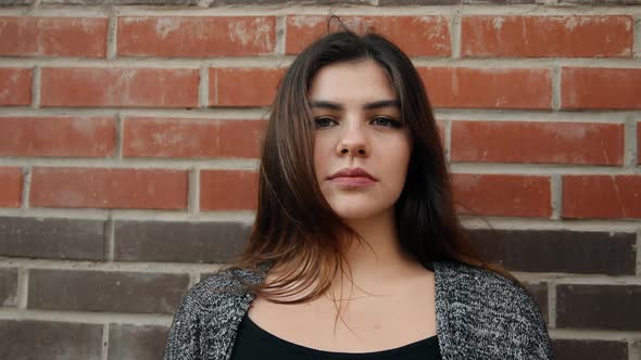 Young Serious Woman Smiling alt