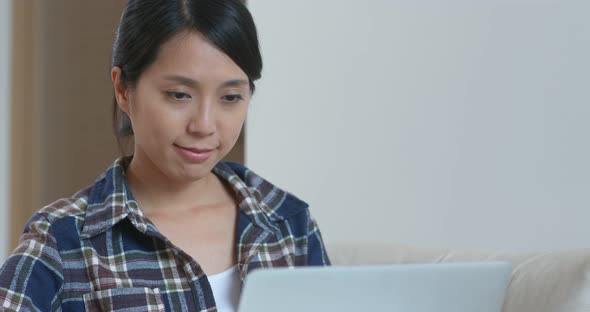 Woman work on computer at home alt