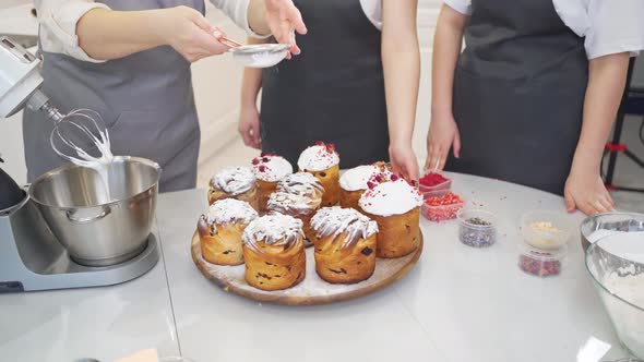 Decorated Panettone and Sprinkling with Powdered Sugar on Cruffins alt