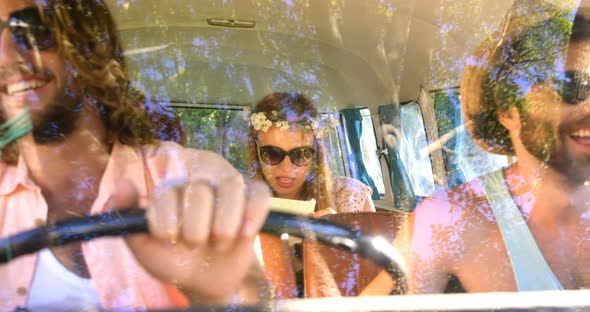 Hipster friends watching a maps in the van alt