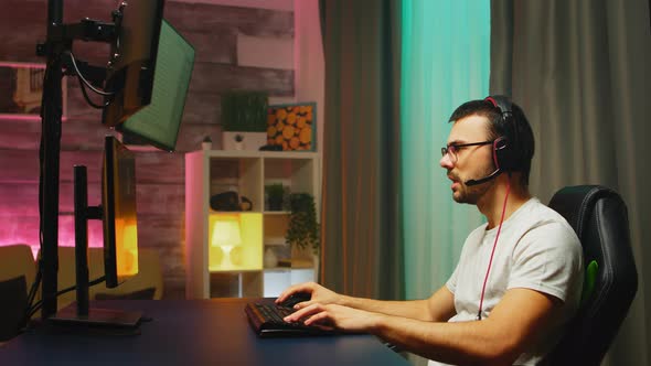 Professional Young Gamer Playing Shooter Games alt