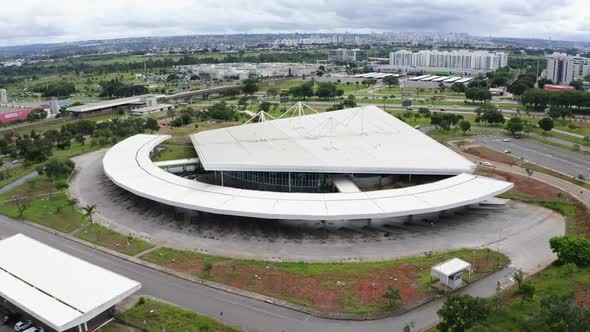 Empty bus terminal in Brasilia during COVID-19 pandemic. Tilt up, downtown in the background alt
