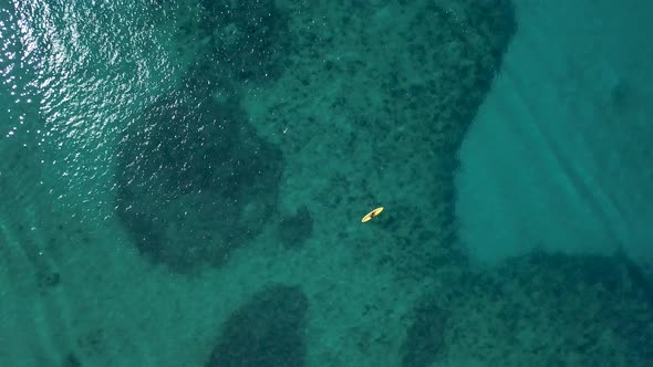 Small Yellow Kayak in Turquoise Caribbean Sea