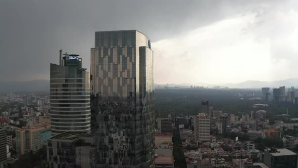Drone Camera Rising and Flying Towards Tall Office Glass Modern Building alt
