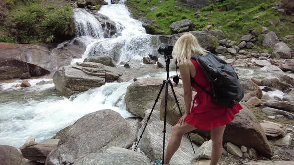 Woman Photographer at Froda Waterfall alt
