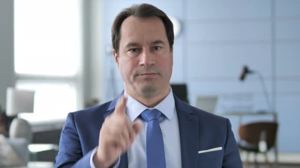 Businessman Pointing with Finger alt