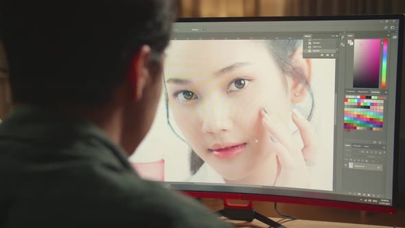 Close Up Asian Male Digital Editor Works In Photo Editing Software On His Personal Computer alt