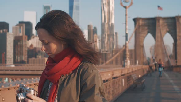 Attractive woman with a retro camera  alt