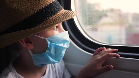 Young Male in Protective Mask While Traveling By Train. Prevention From COVID-19, Coronavirus