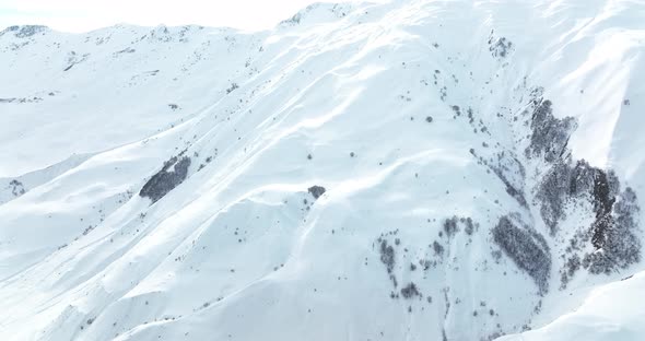Aerial view of beautiful snowy mountains in Gudauri, Georgia alt