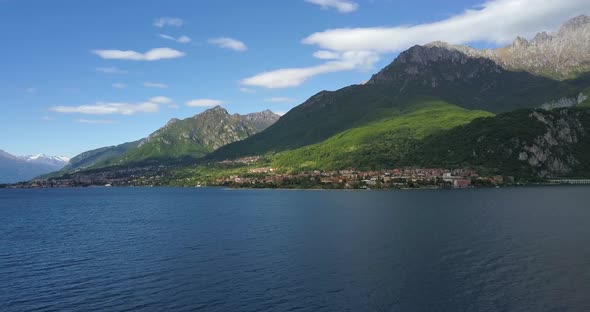 Great View From Drone To Como Lake and the Mountains in Italy. Drone Flies Over the Water