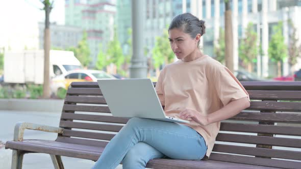 Indian Woman Having Back Pain While Using Laptop in Office alt