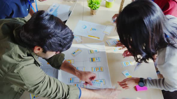 Meeting of UX developer and UI designer brainstorming about mobile app interface workflow alt